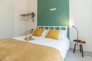 Ένα ή περισσότερα κρεβάτια σε δωμάτιο στο Appartamento in corte privata doppio parcheggio gratuito