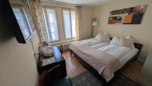 Postelja oz. postelje v sobi nastanitve Hotel Harder Minerva