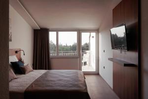 Postel nebo postele na pokoji v ubytování Hotel Stari Dvor