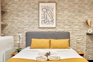 Voodi või voodid majutusasutuse Studio Le Marais by Studio prestige toas