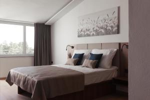 Postel nebo postele na pokoji v ubytování Hotel Stari Dvor + 37 fotografií