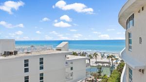 a view of the beach from the balcony of a building at Crescent Siesta Key Charmer in Siesta Key