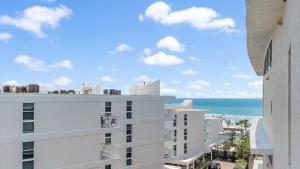 a view of the ocean from the balcony of a building at Crescent Siesta Key Charmer in Siesta Key +28 photos