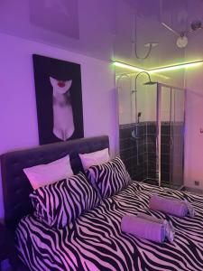 Ένα ή περισσότερα κρεβάτια σε δωμάτιο στο The naturist glamour suite