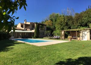 a house with a swimming pool in a yard at Villa Saint Paul in Saint Paul de Vence