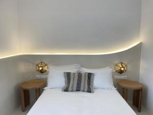 A bed or beds in a room at Faros Residences