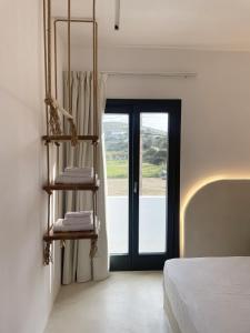 A bed or beds in a room at Faros Residences