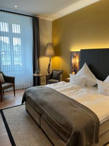 Postel nebo postele na pokoji v ubytování Boutique-Hotel Moseltor