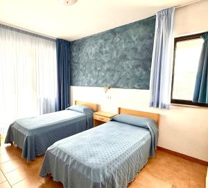 Postel nebo postele na pokoji v ubytování Hotel Timiama