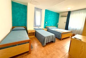 Postel nebo postele na pokoji v ubytování Hotel Timiama