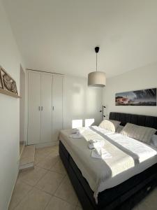 a bedroom with a large bed in a room at Villa Punta in Zadar