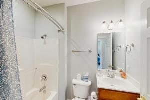 a bathroom with a toilet and a sink and a shower at Siesta Sunset Retreat in Moneta +17 photos