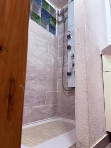 a bathroom with a shower with a glass door at CASA VACANZE NORA in Chamois +71 photos