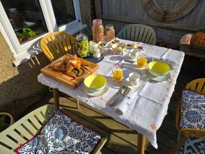 a table with food and drinks on top of it at Imogens Bed & Breakfast in Seaford