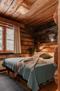 Postel nebo postele na pokoji v ubytování Rukanhohde