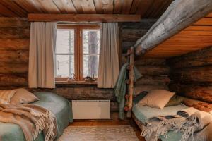 Postel nebo postele na pokoji v ubytování Rukanhohde