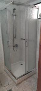 a shower with a glass door in a bathroom at Rodica Studios in Kallithea Halkidikis +14 photos