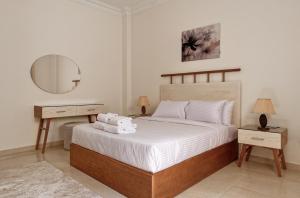 Postel nebo postele na pokoji v ubytování VESTA - New Cairo Residence