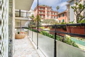 an apartment balcony with a view of a courtyard at Casa Alyx by PortofinoHomes in Santa Margherita Ligure