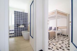 a bathroom with a bedroom with a bed and a tub at Casa Alyx by PortofinoHomes in Santa Margherita Ligure +87 photos