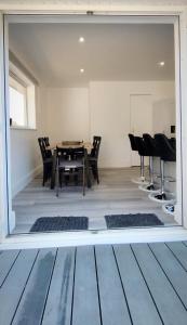 a dining room with a table and chairs at Taunton Retreat in Wilton