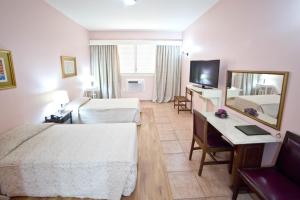 Dayrell Hotel e Centro de Convenções客房内的一张或多张床位