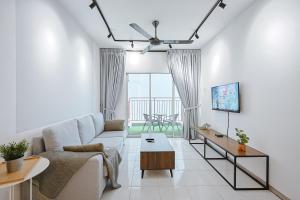 a living room with a couch and a table at Modern Studio Retreat -Prime Location Clover Home 1-03 in Brinchang