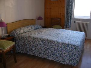 Postel nebo postele na pokoji v ubytování Hôtel Modern