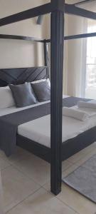 Ένα ή περισσότερα κρεβάτια σε δωμάτιο στο Sunset Haven Homes