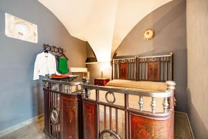 a bedroom with a wooden bed in a room at Studio Raguso in Martina Franca