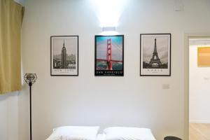 a room with four pictures on the wall at Lo Casale in Buonalbergo +13 photos