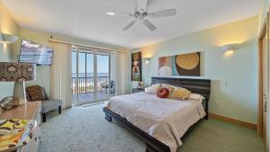 a bedroom with a bed and a view of the ocean at Gulf View Escape in Siesta Key