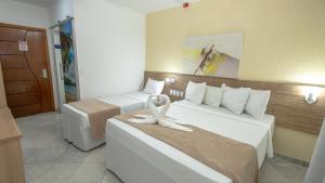 Postel nebo postele na pokoji v ubytování Hotel Beach Hills