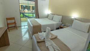 Postel nebo postele na pokoji v ubytování Hotel Beach Hills + 37 fotografií