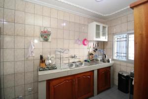 Eldhús eða eldhúskrókur á RJS Appart Homey1 avec Jacuzzi