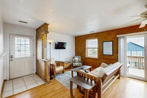 a living room with a couch and a table at Tarpon Drive Hideaway Unit B in Avon