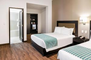 Voodi või voodid majutusasutuse Wyndham Costa del Sol Piura toas