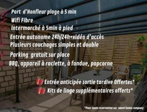 un gruppo di parole su un cartello davanti a un edificio di SPACIEUX Appart Jacuzzi Terrasse Parking 10min port d'Honfleur Plage a Honfleur