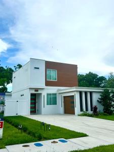 a large white house with a brown at Paradise Found in Sarasota