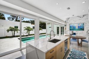 a kitchen with a sink and a pool at Paradise Found in Sarasota +45 photos