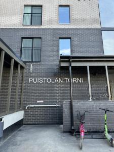 a bike parked in front of a brick building at Cosy studio in the center of Jyvaskyla in Jyväskylä