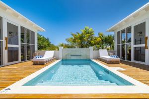 a swimming pool in the backyard of a house at Endless Summer and Pool Club at Mahogany Bay Unit B in San Pedro +9 photos