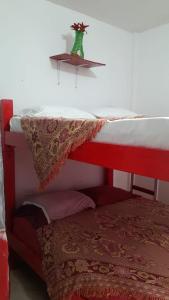 a bed with a table on top of it at Caribe Tolú in Tolú