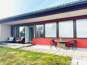 a patio with a table and chairs on a building at Tullikatu Two-Bedroom Apartment in Kristinestad
