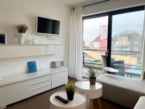 Μια τηλεόραση ή/και κέντρο ψυχαγωγίας στο Appartementhaus Seemöwe Strandmöwe