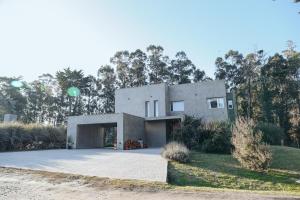 a large concrete house with a driveway at Benita Haus in La Estafeta