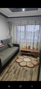 a living room with a couch and a coffee table at Vila Simona in Curtea de Argeş +17 photos