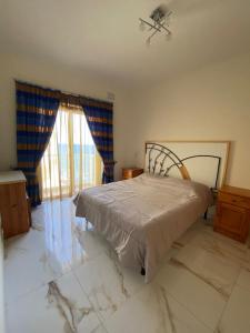 Letto o letti in una camera di Horizon Apartments Gozo