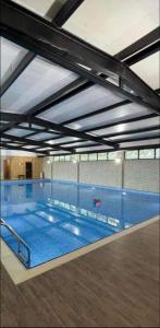 a large swimming pool in a building at Bakuriani Crystal in Bakuriani