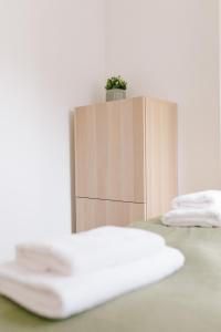 Postel nebo postele na pokoji v ubytování stay-a-while Apartment I Hannah I WLAN, kostenloser Parkplatz, Netflix